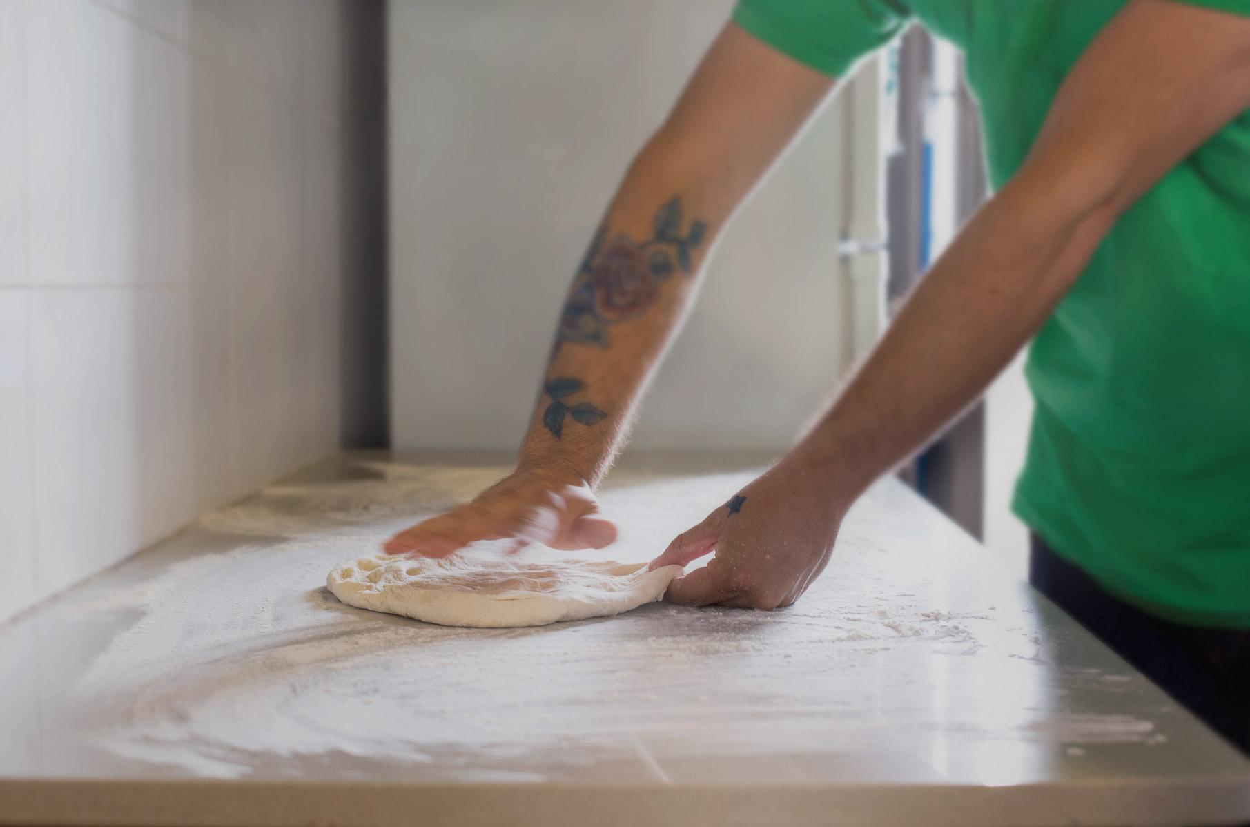 Person kneading dough on a countertop