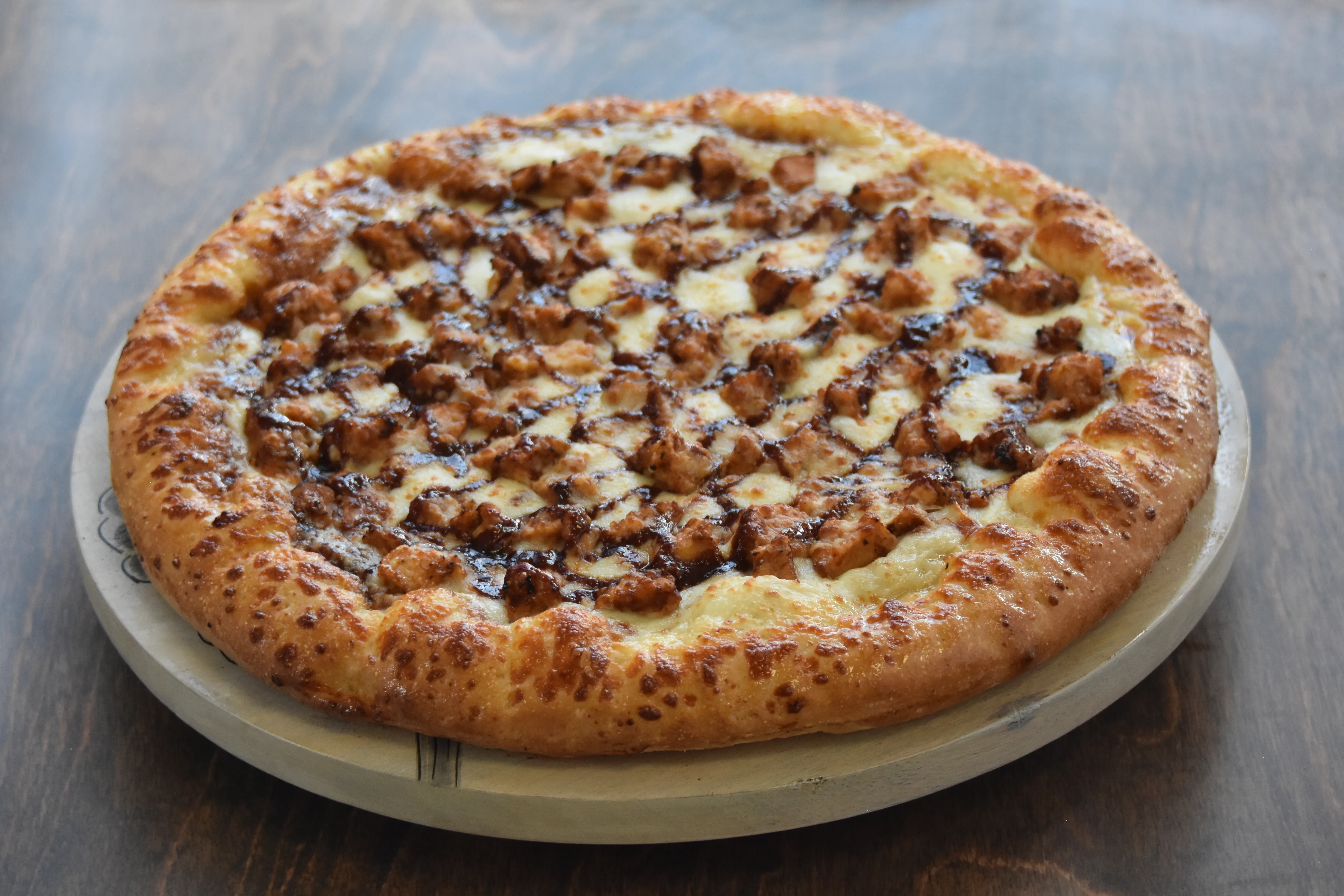 Delicious pizza topped with grilled chicken pieces