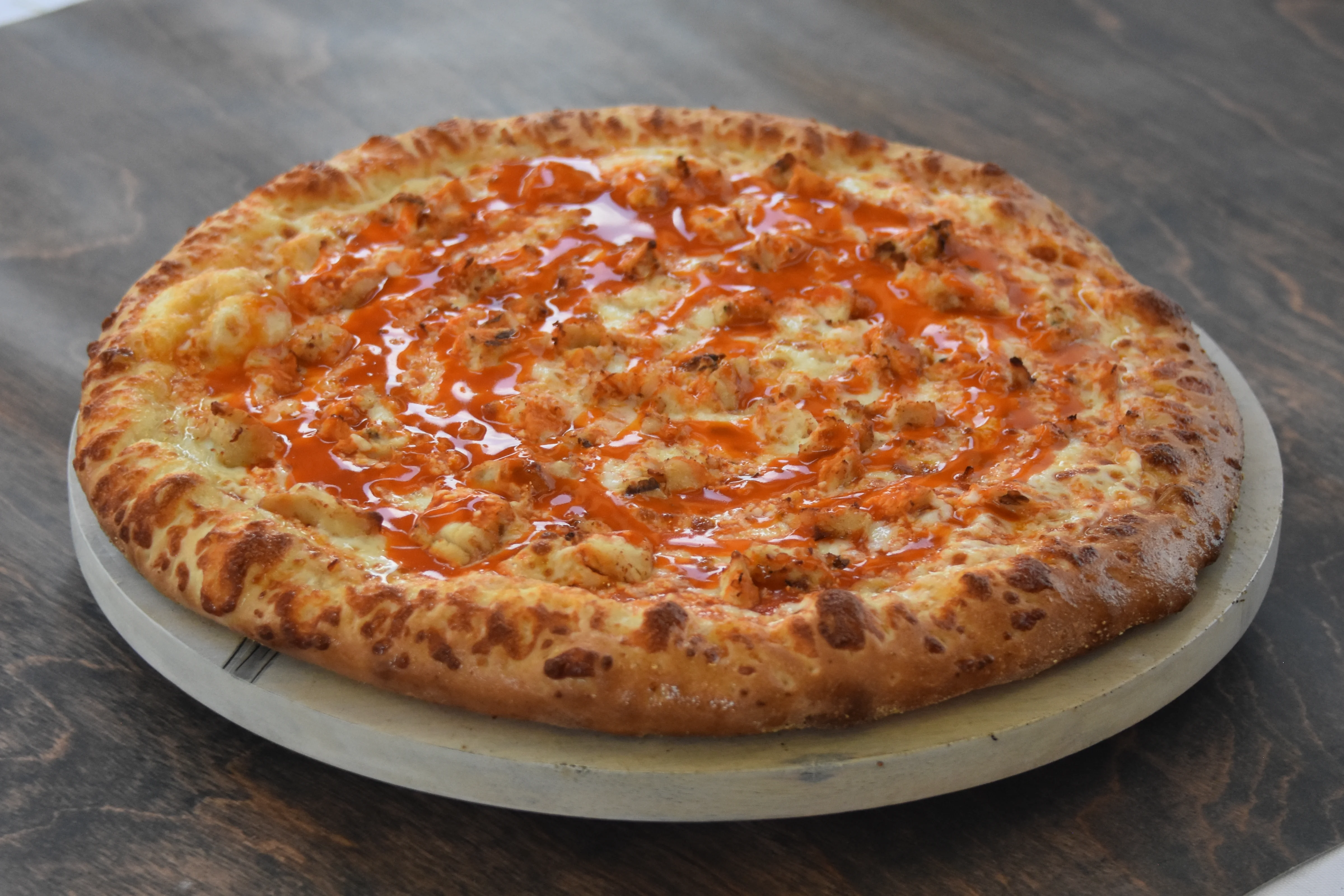 Succulent pizza with golden crust and spicy sauce